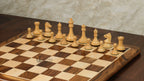 3.75” REPRODUCTION OF DRUEKE PLAYER CHOICE GOLDEN ROSEWOOD CHESS PIECES, 21” GOLDEN ROSEWOOD BOARD AND CHESS BOX