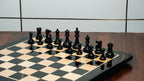 3.75” THE FISCHER SPASSKY 1972 SERIES EBONISED DOUBLE WEIGHTED CHESS PIECES, 21” EBONY BOARD & BOX