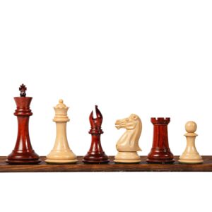 3.1 inch Royal Knight Staunton weighted chess pieces displayed on a wooden chess board, premium handcrafted tournament chess set in classic red and natural finish.